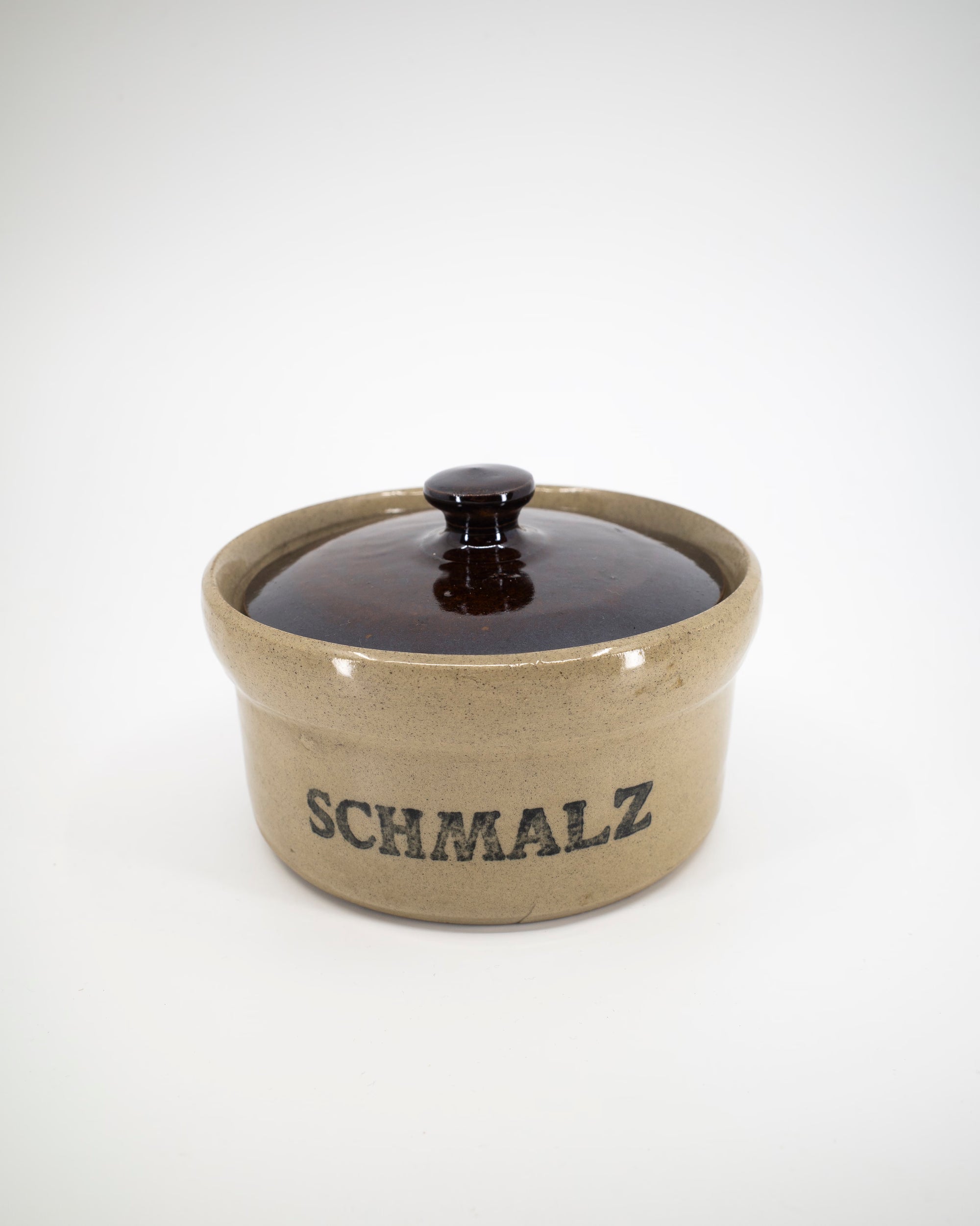 Ceramic container with lid labeled 'SCHMALZ' on a white background